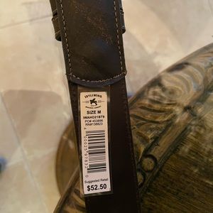 Beautiful brown leather belt with studding accents.